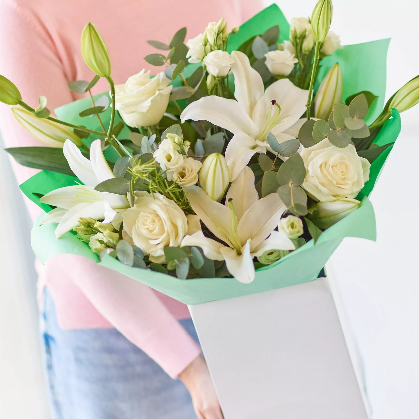 Ethereal Beauty: White Lilies, Roses, and Eucalyptus Bouquet