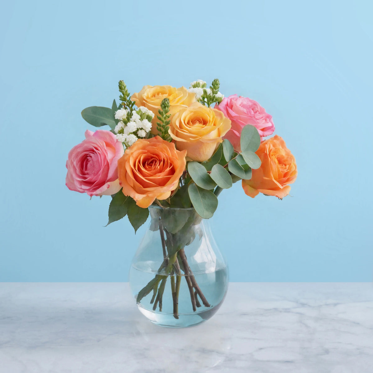 Soft Elegance: A Bouquet of Roses and Eucalyptus