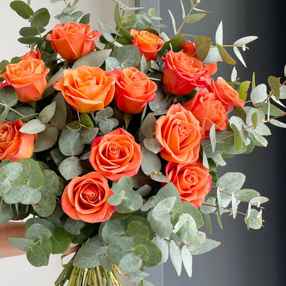 A Beautifully Arranged Bouquet Orange Juice Roses