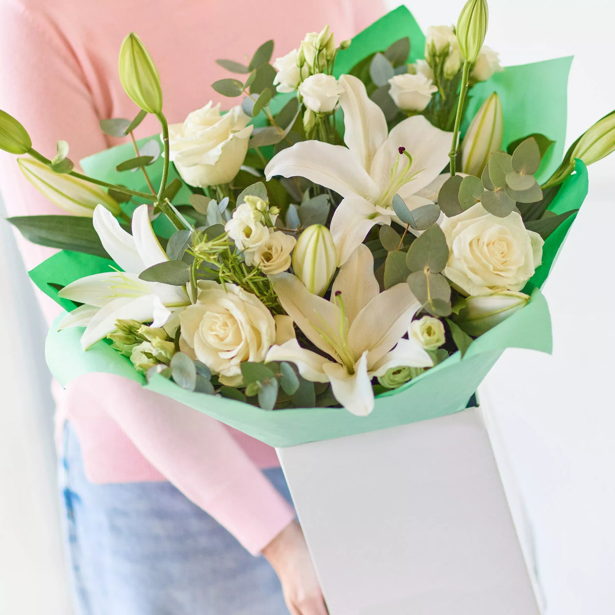 Ethereal Beauty: White Lilies, Roses, and Eucalyptus Bouquet
