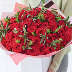 Love’s Essence: 51 Red Roses and Graceful Greenery