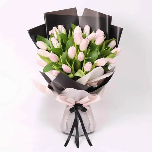 Radiating charm and grace, our Pink Tulip Bouquet is a delightful expression of love and affection. Each stem is carefully selected to showcase the tulip's soft petals and captivating hue, creating a stunning arrangement that symbolizes admiration and appreciation. Perfect for any occasion, it's a gesture sure to bring smiles and warmth to your recipient's heart.