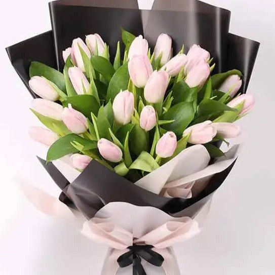 Radiating charm and grace, our Pink Tulip Bouquet is a delightful expression of love and affection. Each stem is carefully selected to showcase the tulip's soft petals and captivating hue, creating a stunning arrangement that symbolizes admiration and appreciation. Perfect for any occasion, it's a gesture sure to bring smiles and warmth to your recipient's heart.