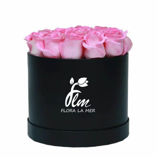 Embrace sophistication with our Elegant Pink Rose Round Box. Adorned with velvety pink roses arranged meticulously within a chic round box, this exquisite ensemble exudes timeless charm and grace. Whether for a romantic gesture or a refined touch to your decor, these roses elevate any setting with their delicate beauty and subtle fragrance.