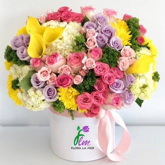 "Box Mixed Flowers: A delightful arrangement bursting with a variety of colorful blooms, carefully curated to bring joy and beauty to any space. Perfect for gifting or adding a touch of nature's charm to your own home decor."